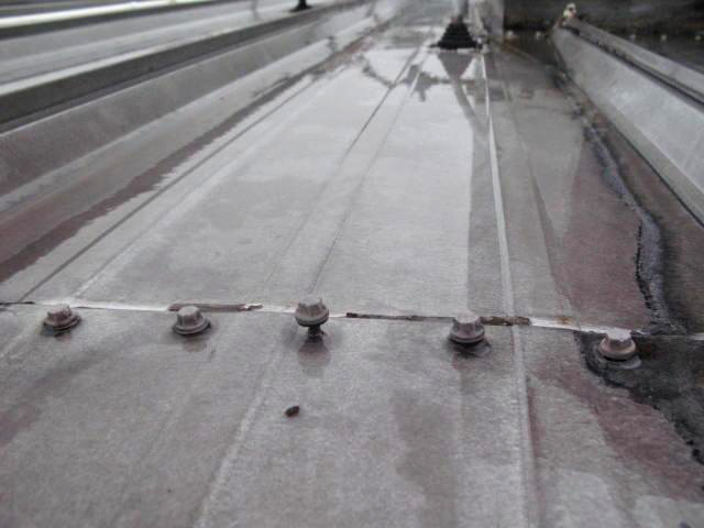 Metal roof fastener backout Metal roof fastener backout